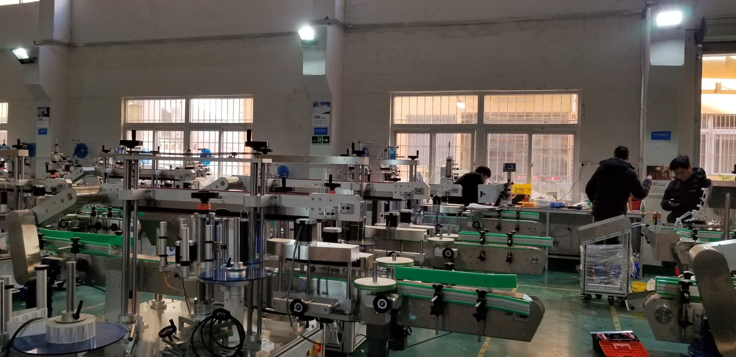 Inline labeling line being wired and commissioned on the HiPaks floor