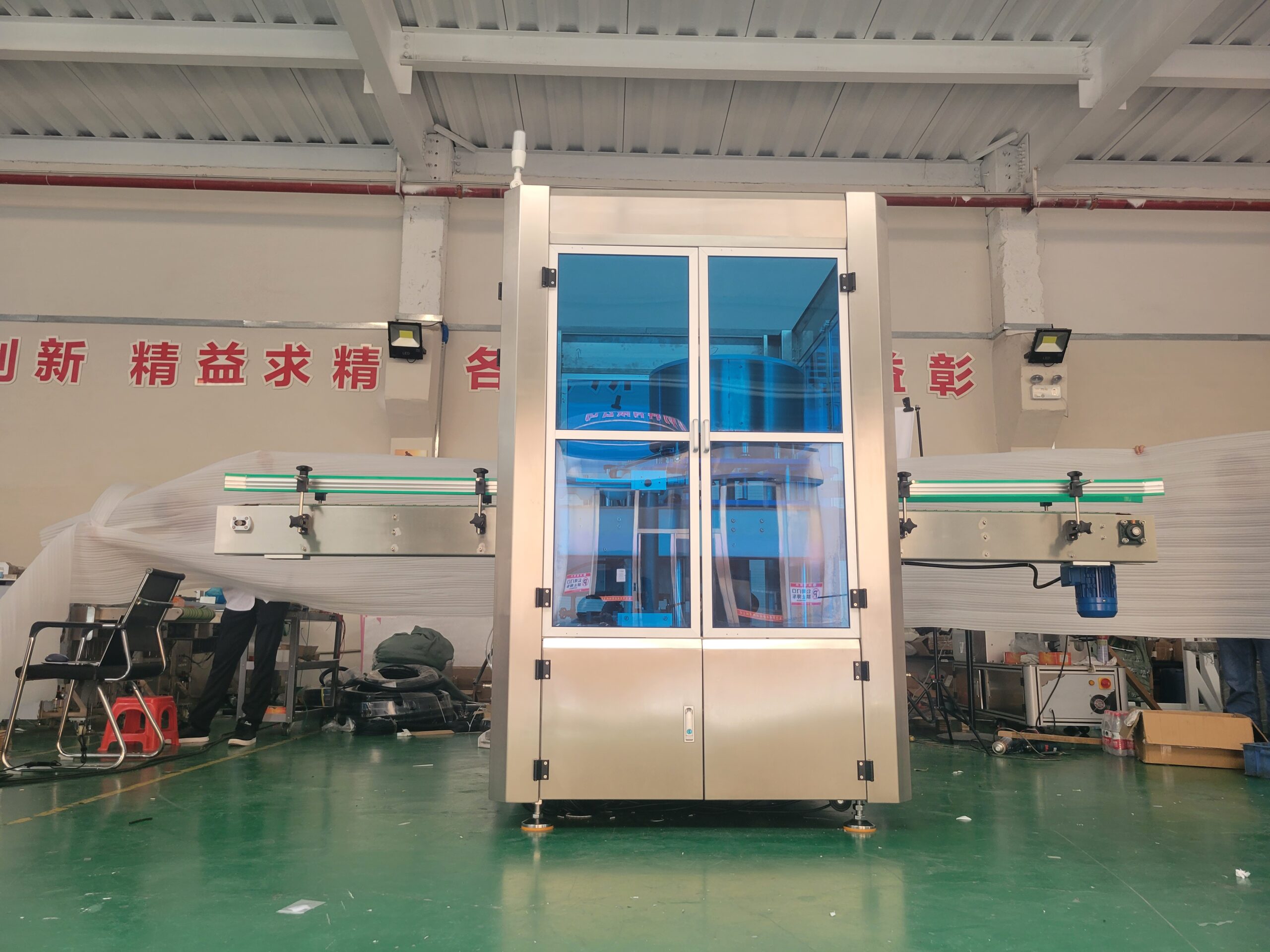 Hot melt labeling machine roll-fed label web path