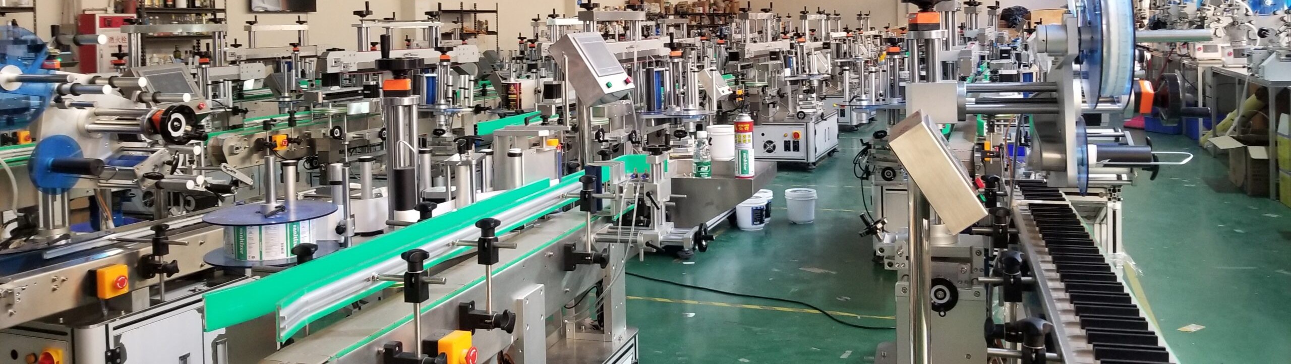 Finished HiPaks labeling machines lined up at the factory warehouse, ready for export packing and shipping